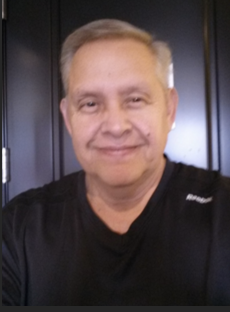 A Hispanic male wearing a black t-shirt
