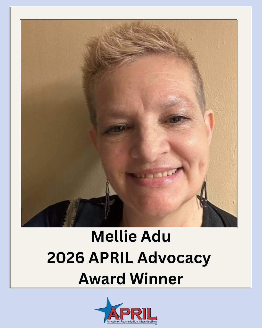 Close up photo of Mellie Adu, a white woman with short pixie cut blonde hair.